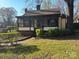 Charming home with a screened-in porch and a well-maintained front yard at 1109 West Blvd, Charlotte, NC 28208