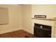Cozy living room with hardwood floors, a fireplace, and natural light at 1109 West Blvd, Charlotte, NC 28208