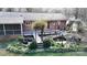 Aerial view of backyard with pond, lush landscaping, and deck at 116 Jonas Dr, Lincolnton, NC 28092