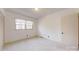 Bright bedroom features neutral carpet, natural light from a window, and closet storage at 116 Jonas Dr, Lincolnton, NC 28092