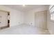 Bright bedroom features neutral carpet, natural light from a window, and closet storage at 116 Jonas Dr, Lincolnton, NC 28092
