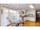 Eat-in kitchen features hardwood floors, a bay window, and stainless steel appliances at 116 Jonas Dr, Lincolnton, NC 28092