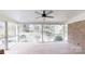 Screened patio with brick floor, fan, and outdoor view at 116 Jonas Dr, Lincolnton, NC 28092