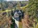 Stunning aerial view of a two-story home with a well-manicured yard surrounded by lush trees at 124 Gatlin Knl # 11, New London, NC 28127