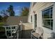 Charming balcony boasts outdoor seating with view of lush green landscape at 124 Gatlin Knl # 11, New London, NC 28127