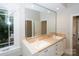 Bright bathroom featuring double sinks, large mirrors, neutral color palette, and natural light from a window at 124 Gatlin Knl # 11, New London, NC 28127