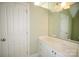 Bright bathroom features a white vanity with drawers, sink, and large mirror at 124 Gatlin Knl # 11, New London, NC 28127