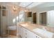The primary bathroom features double sinks, and separate tub and shower with tile surround at 124 Gatlin Knl # 11, New London, NC 28127