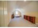 Spacious bonus room with ample natural light, neutral carpet, and a ceiling fan at 124 Gatlin Knl # 11, New London, NC 28127