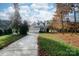 Charming home with a three-car garage and mature trees lining the driveway at 124 Gatlin Knl # 11, New London, NC 28127