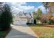 Charming two-story home boasts a two-car garage and well-kept lawn with mature trees at 124 Gatlin Knl # 11, New London, NC 28127