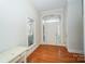 Inviting foyer with hardwood floors and transom windows above double front doors and next to front window at 124 Gatlin Knl # 11, New London, NC 28127