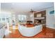 Spacious living room features a stone fireplace, hardwood floors, and large windows with natural light at 124 Gatlin Knl # 11, New London, NC 28127