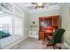 Bright home office features built-in shelves, a large window, and traditional wood desk at 124 Gatlin Knl # 11, New London, NC 28127