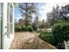 Paver patio overlooking a lush, green lawn and professionally landscaped garden at 124 Gatlin Knl # 11, New London, NC 28127