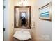Small powder room with a pedestal sink and a framed mirror at 124 Gatlin Knl # 11, New London, NC 28127