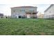 Expansive backyard with lush green grass, a covered patio, and a fenced perimeter at 1501 Allegheny Way, Waxhaw, NC 28173