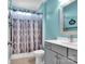 Bathroom with a modern vanity, shower and blue walls at 1501 Allegheny Way, Waxhaw, NC 28173