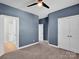 Spacious bedroom with carpet, ceiling fan, and neutral color palette offers a cozy and inviting atmosphere at 1501 Allegheny Way, Waxhaw, NC 28173