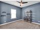 This bedroom features a large window, carpet floors, neutral colors and ample light at 1501 Allegheny Way, Waxhaw, NC 28173