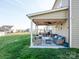 Relaxing covered patio with stylish outdoor furniture, perfect for entertaining and lounging at 1501 Allegheny Way, Waxhaw, NC 28173