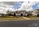 Charming two-story home featuring manicured lawn, welcoming entryway, and classic architectural design at 1501 Allegheny Way, Waxhaw, NC 28173