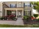 Inviting covered front porch with stylish decor and charming curb appeal at 1501 Allegheny Way, Waxhaw, NC 28173