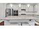 Bright kitchen with stainless steel appliances, granite countertops, and elegant pendant lighting at 1501 Allegheny Way, Waxhaw, NC 28173