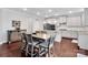 Bright kitchen features a large island, stainless steel appliances, and a dining area at 1501 Allegheny Way, Waxhaw, NC 28173