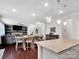 Open concept living and kitchen area with granite countertops at 1501 Allegheny Way, Waxhaw, NC 28173
