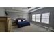 Comfortable main bedroom featuring plush carpeting, tray ceiling, and plenty of natural light at 1501 Allegheny Way, Waxhaw, NC 28173