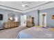 This primary bedroom features carpet floors, a ceiling fan, and doorways to other rooms at 1501 Allegheny Way, Waxhaw, NC 28173