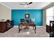 Bright office space featuring a blue accent wall, modern desk setup, and natural light at 1501 Allegheny Way, Waxhaw, NC 28173