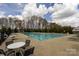 Community pool featuring lap lanes, ample lounge space, and meticulously kept grounds beneath cloudy skies at 1501 Allegheny Way, Waxhaw, NC 28173