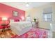 Bright bedroom with colorful accents, hardwood floors, and two windows at 15115 Rocky Bluff Loop, Davidson, NC 28036