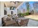 Relaxing covered patio with comfortable seating and outdoor TV at 15115 Rocky Bluff Loop, Davidson, NC 28036
