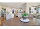 Dining area with access to patio and an open view of the kitchen and living area at 15115 Rocky Bluff Loop, Davidson, NC 28036