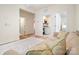 Hallway with hardwood floors and a comfortable couch, leading to multiple rooms at 15115 Rocky Bluff Loop, Davidson, NC 28036