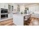 Stylish kitchen with a center island and bar seating, stainless steel appliances, and ample storage at 15115 Rocky Bluff Loop, Davidson, NC 28036
