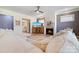 Cozy living room with fireplace, large sectional sofa, and decorative rug at 15115 Rocky Bluff Loop, Davidson, NC 28036