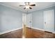 Spacious bedroom featuring hardwood floors, ceiling fan, and neutral wall paint at 1631 Fulton Ave, Charlotte, NC 28205