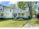 Cottage-style home showcasing a classic front porch, tidy lawn, and a driveway at 1631 Fulton Ave, Charlotte, NC 28205