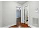 Hallway with hardwood floors leads to bedroom and bathroom at 1631 Fulton Ave, Charlotte, NC 28205