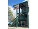 Midwood Smokehouse's exterior features an outdoor staircase and rustic signage at 1631 Fulton Ave, Charlotte, NC 28205