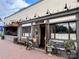 Charming restaurant exterior with sidewalk seating, flower boxes, and vintage bicycle at 1631 Fulton Ave, Charlotte, NC 28205