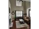 Spacious living room with vaulted ceilings, large windows, a fireplace, and hardwood floors at 18224 Taffrail Way, Cornelius, NC 28031
