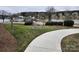 Tranquil waterfront featuring a boardwalk, waterfront access, and well maintained landscaping at 18224 Taffrail Way, Cornelius, NC 28031