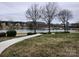 Scenic view of the waterfront featuring a boardwalk and lush landscaping at 18224 Taffrail Way, Cornelius, NC 28031