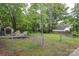 Fenced backyard with an elevated deck and garden area at 1900 Union St, Charlotte, NC 28205