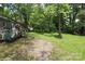Lush backyard with a deck and a charming wooded area at 1900 Union St, Charlotte, NC 28205